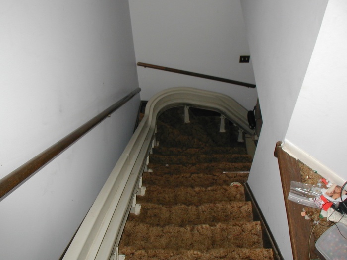This is from the 2nd floor looking down the stairs to the 1st floor.  The track on the left is for a stair lift.  For a while, my dad couldn't get up and down the stairs easily, so this was installed.
