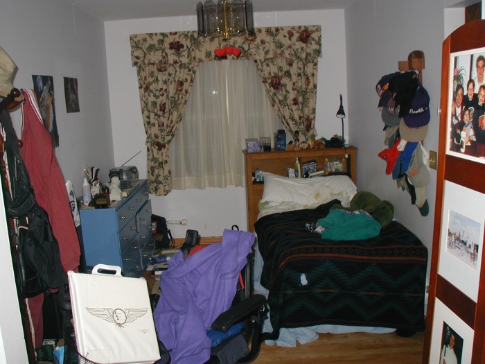 This is a picture of my dad's bedroom, formerly the dining room.  The divider on the right is filled with pictures.