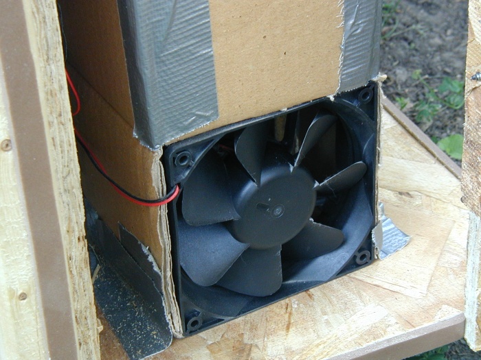 The lower intake fan for the hard drives is not something to put fingers into.  Also notice the brown weather stripping.  It sealed the gap with the doors, and helped reduce noise significantly.