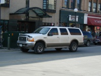 An obscenely large Ford Excursion in downtown Iowa City.  Prarie Lights (a nice bookstore) is in the background, as is Micky's.