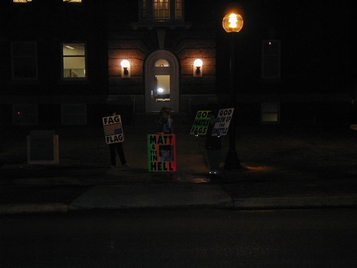 The GodHatesFags crew out holding their signs protesting the "Laramie Project" play at Cornell College.
