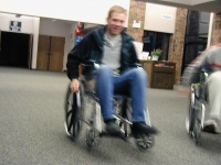 Chad, blurry, in a wheelchair.