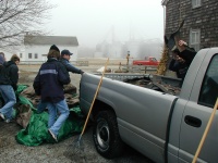 We scraped all the shingles into the tarp - then the tarp had to be dumped into the truck.