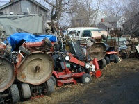 The neighbor had a stack of a LOT of lawnmowers out back.
