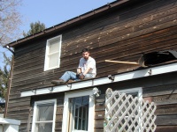 Tony Hill sitting on the lower roof.