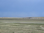 Badlands.  Also, a storm in the distance.