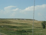 Badlands, in the distance.  The radio antenna, in the foreground.