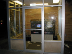 The windows were broken at the ATM station.  The machines were untouched.