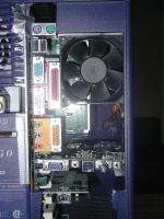 It's a standard ATX mainboard in there, with an AGP video card.  The fan keeps everything cool.